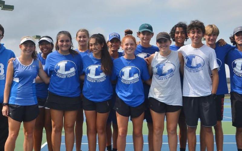 COURTESY PHOTO The Badger tennis squad poses for a photo after their win over Decatur in the bi-district playoff round on Tuesday.