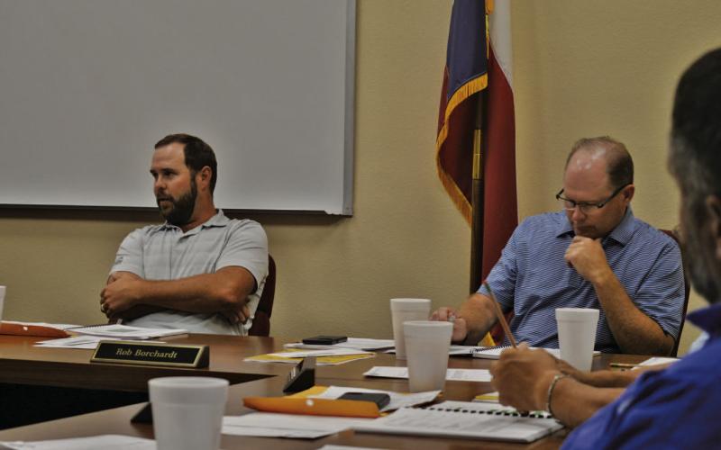At left, Lampasas ISD Board of Trustees President Ryan Shahan leads discussion at Monday’s meeting as Board Vice President Rob Borchardt looks on. ERICK MITCHELL | DISPATCH RECORD