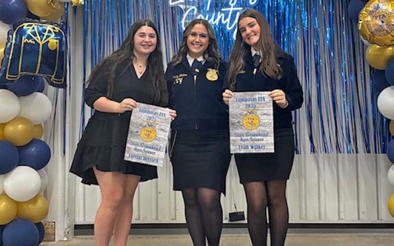 Lorelai Dressell, left, and Leah Walker, right are presented the Star Greenhand award from Trinity Watkins. Dressell and Walker were honored for their work in Agriscience. COURTESY PHOTO