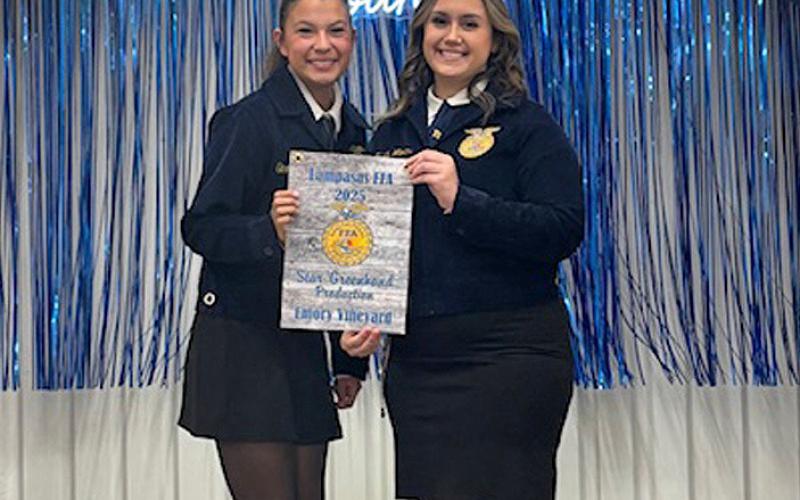 COURTESY PHOTO Earning the Star Greenhand award for her efforts in Production is Emory Vineyard, at left. FFA officer Trinity Watkins presented the award at the recent banquet.