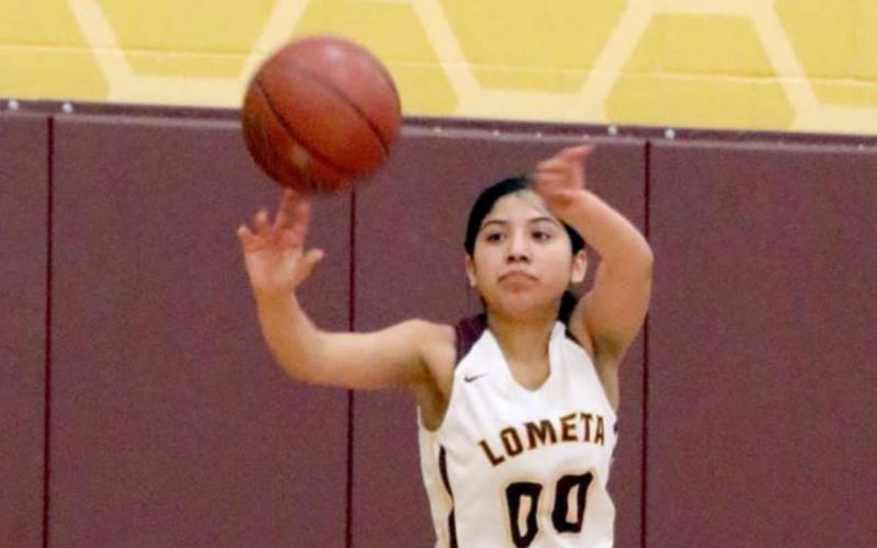 Emily Andrade passes the ball in a 38-37 Lometa victory on Friday. JESSICA MALDONADO | LOMETA ISD