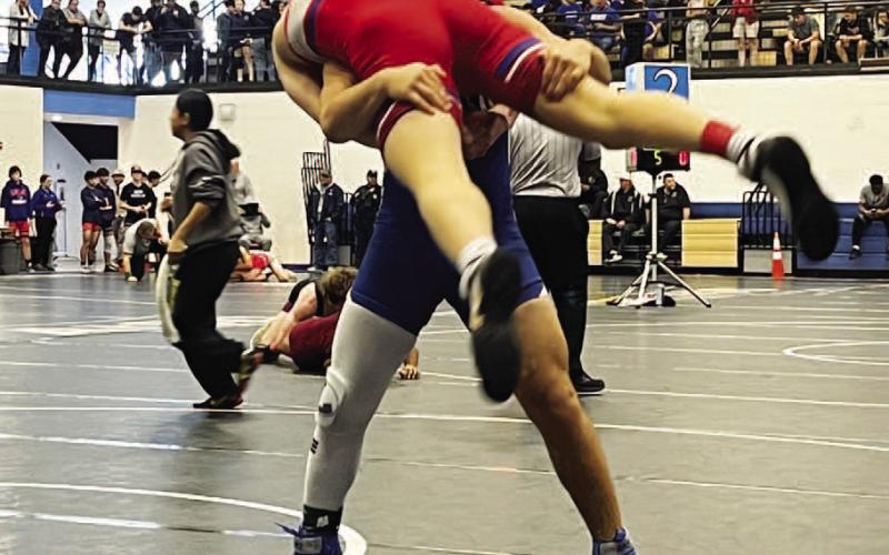 Daemian Rivas picks up his opponent during a match last week. COURTESY PHOTO