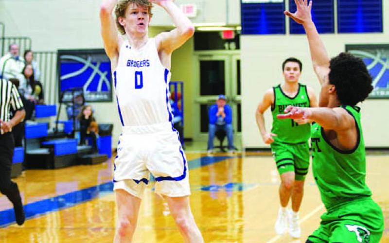Peyton Sisson shoots over the hand of a Burnet defender. HUNTER KING | DISPATCH RECORD