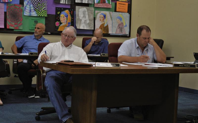 ERICK MITCHELL | DISPATCH RECORD LISD board members Mickey Edwards and Sam Walker look on during Wednesday’s called meeting.