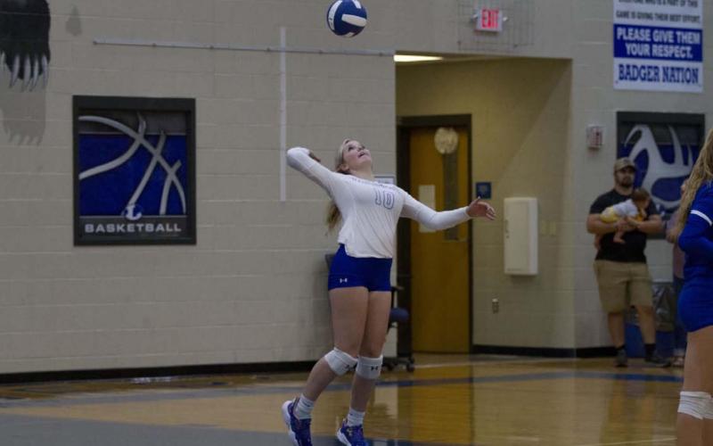 Laurcy Bender goes up for a serve during the Lady Badgers’ match last week against Glen Rose. HUNTER KING | DISPATCH RECORD