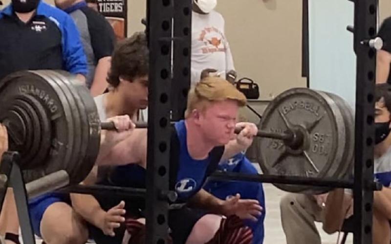 Westen Reid squats at Saturday’s meet in Smithville, where he stayed undefeated for the season. JAN BRISTER | COURTESY PHOTO