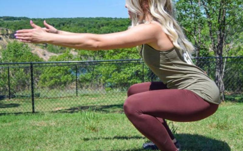 The basic air squat should be conducted with feet shoulder-width apart. Maintain neutral spinal posture in this movement. COURTESY PHOTO