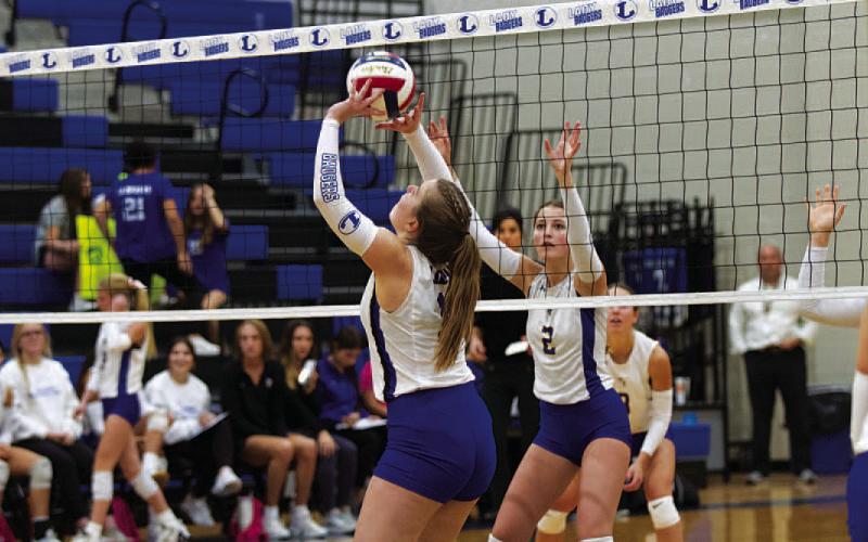 Ava Dowdy sets for a kill during the match against Lago Vista. HUNTER KING | DISPATCH RECORD