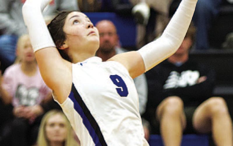 Lilee Hamill rises up for a spike. HUNTER KING | DISPATCH RECORD