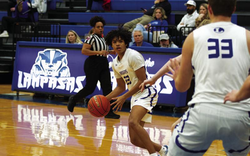 Angel Scott looks to pass to Beau Patterson in the post. HUNTER KING | DISPATCH RECORD