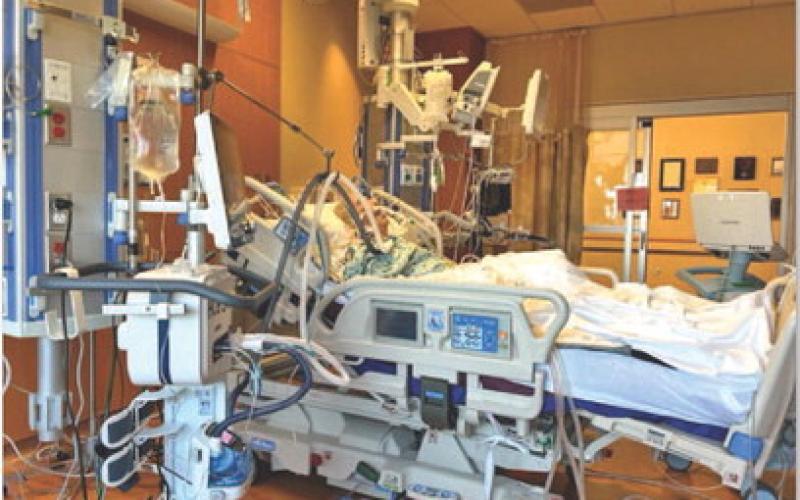Local realtor Ron Kuker lies in a Houston hospital bed in the Intensive Care Unit before receiving a heart transplant. DEBBIE KUKER | COURTESY PHOTO