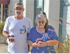 Ruth and David Somers hold up jars of their strawberry fig jam and zucchini salsa. erick mitchell | dispatch record