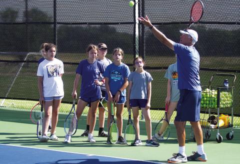 FILE PHOTO Kenneth Peiser is back coaching young Lampasas tennis players this summer at the annual camp.