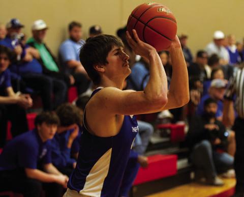 HUNTER KING | DISPATCH RECORD Calum Mitchell shoots a three-point shot during last week’s district contest.