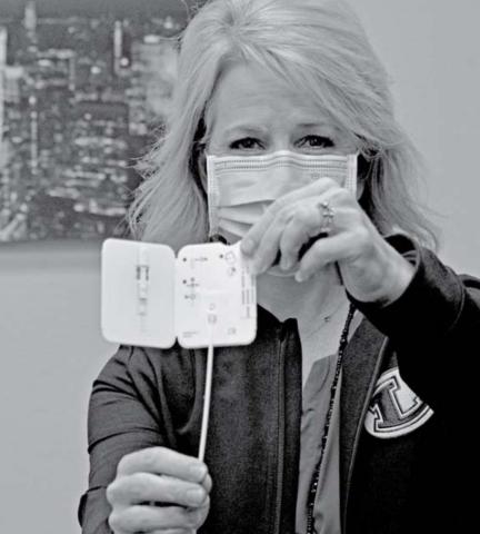 Donna Clark, the director of school health services for the Lampasas ISD, holds a COVID test strip. She said the district is being proactive regarding student health and is focused on keeping students healthy and in class. FILE PHOTO