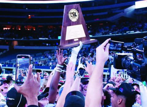 China Spring players hoist the State Champion trophy high, following their 24-21 comeback victory over Boerne. MASON HINES | DISPATCH RECORD