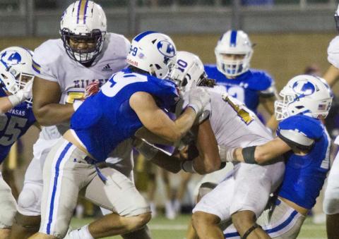 On fourth down, Ian McKinney (99) and Case Brister (far right) tackle one of the state’s top quarterbacks, Andrew Body, to give the Badgers one last offensive drive as they attempt a 19-point comeback. JEFF LOWE | DISPATCH RECORD