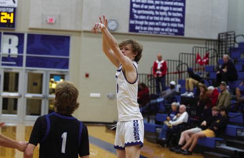 HUNTER KING | DISPATCH RECORD Peyton Sisson shoots over a Whitney defender. He scored 24 points in last Friday’s contest.