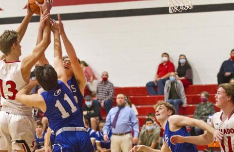 Tak Stinnett (11) and Landon Mulcahy go for a rebound as Quinn Pace (second from right) blocks out against Salado last Tuesday. Lampasas (16-1) brings a 15-game winning streak into the Jan. 12 district opener at Stephenville. On Friday, the Badgers will host No. 21 Glen Rose. JEFF LOWE | DISPATCH RECORD