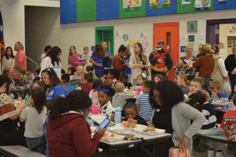 Hundreds of family members visited their students at Taylor Creek Elementary School for Friday’s Thanksgiving feast during lunchtime. erick mitchell | dispatch record
