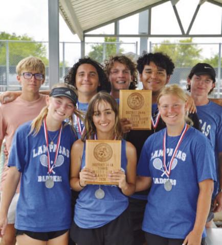 HUNTER KING | DISPATCH RECORD Tennis players show off their plaques from the district tournament.