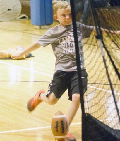 Badger coaching staff leads youth football camp