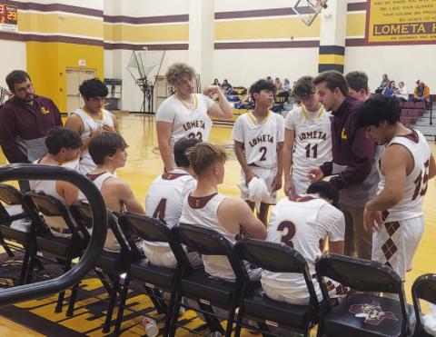 COURTESY PHOTO | CHERI WIENECKE Lometa boys’ basketball head coach Austin Martin draws a play during Lometa’s tournament game against Rising Star on Friday. The Hornets fell to Rising Star 66-53 in a physical and fast-paced game.