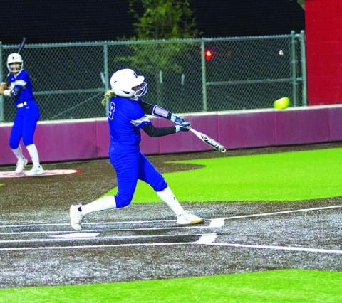 HUNTER KING | DISPATCH RECORD Brady Burton swings and delivers one of her two hits during Tuesday’s game.