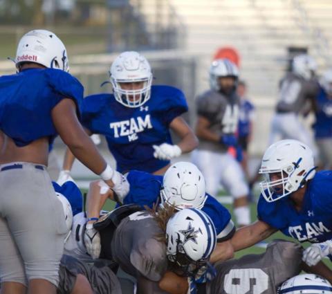 A group of Badgers is in on the tackle of a Navasota ball carrier during the live quarter of the scrimmage. HUNTER KING | DISPATCH RECORD