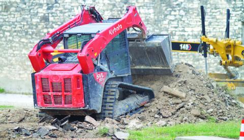 Work crews have been at the former jail lot since Wednesday morning, removing the old base and preparing the property for a chip-seal pavement that will be applied to create a downtown parking lot on East Fourth Street. HUNTER KING | DISPATCH RECORD