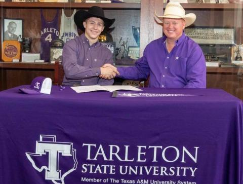 Kempner-area bull rider Riggen Hughes, left, signed with Tarleton State University’s rodeo program. He is shown with coach Mark Eakin. COURTESY PHOTO