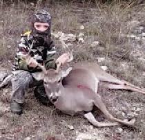 Eight-year-old Gauge Downing killed this buck with his crossbow in Lampasas County. COURTESY PHOTO