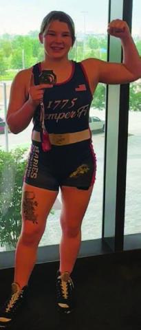Taylor Martell poses with her medal. COURTESY PHOTO