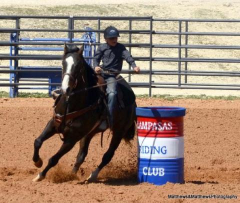 Lucky Bumpas, 8, rides his horse around a barrel during a junior rodeo event in March. COURTESY PHOTO