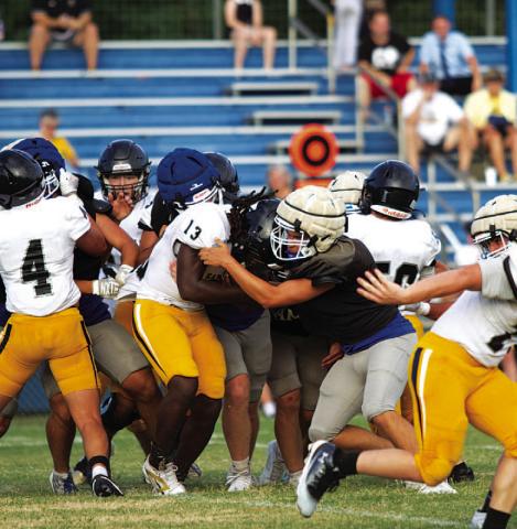 HUNTER KING | DISPATCH RECORD Ayden Vanliew meets the running back in the hole and makes a tackle against Gatesville.