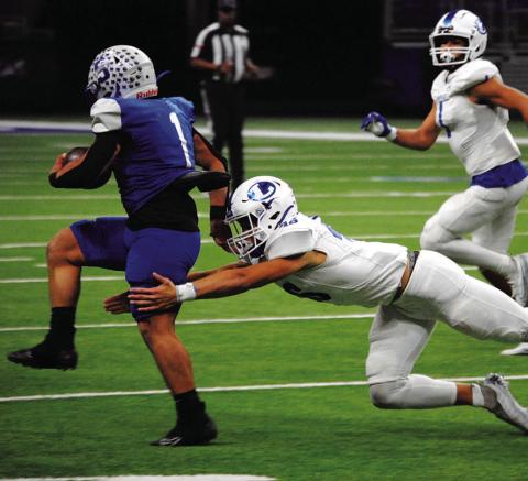 Hagen Oncken dives to make a tackle on the Somerset ball carrier during Friday night’s playoff game. HUNTER KING | DISPATCH RECORD