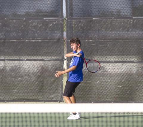 Clayton Shaw finishes on a forehand shot during a recent tennis match in Lampasas. Tennis started district play on Thursday against Stephenville. HUNTER KING | DISPATCH RECORD