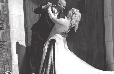 Celebrating outside the United Methodist Church in Cropsey, Illinois, are newlyweds Joshua Schmidgall and his bride, the former Rachel Wolfe. COURTESY PHOTO