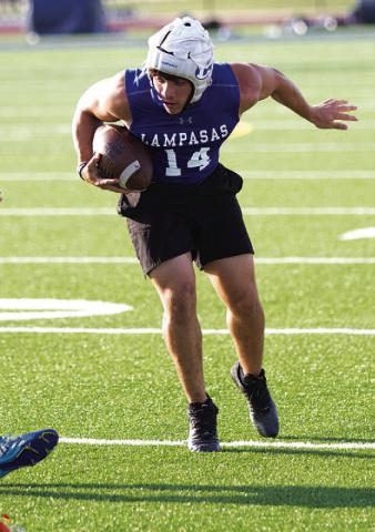 K.J. Reed makes a juke move during 7-on-7. HUNTER KING | DISPATCH RECORD