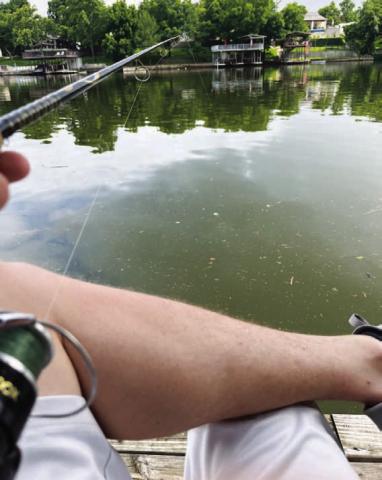 The calm of the water was only interrupted when a fish would bite. HUNTER KING | DISPATCH RECORD