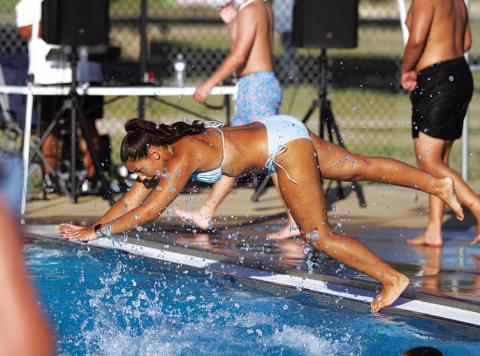 HUNTER KING | DISPATCH RECORD Charlie Freese dives into the deep end of Hanna Springs Pool during the Back to School Bash last Friday evening.