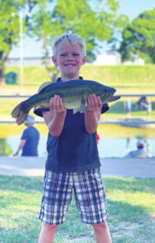 Bobby Chaney is all smiles with his catch from the fishing derby. MONIQUE BRAND | DISPATCH RECORD