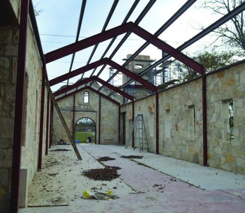 Steel frames have been added to boost the structural integrity of the walls at the former St. Paul’s AME Church. A windstorm in 2019 caused the roof to collapse and the west wall of the structure crumbled, but restoration efforts are aimed at restoring the church building with its “Alamo” resemblance. ERICK MITCHELL | DISPATCH RECORD