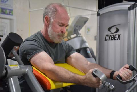 Part of Day One Fitness member Patrick Thompson’s workout routine includes arm curls. The 65-year-old is one of many Lampasans who strive to stay fit year round. MONIQUE BRAND | DISPATCH RECORD