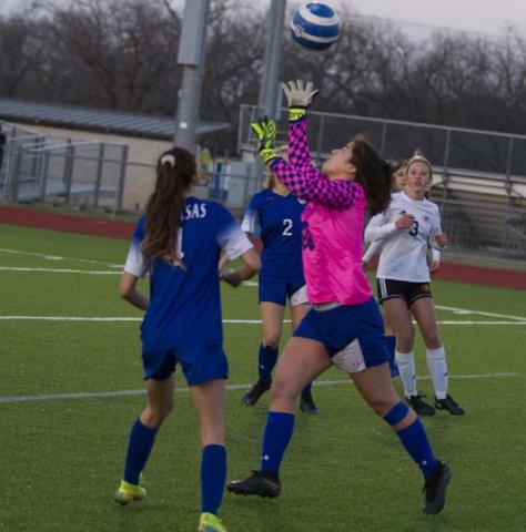 Goalkeeper Keona Cartwright makes a save in the Lady Badgers’ home match against Gatesville, while Nyla Long (4) assists on defense. JEFF LOWE | DISPATCH RECORD