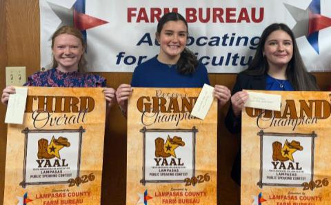 From left, Selie Hodge, Leah Walker and Bailey Gutierrez show off the banners and cash prizes they earned at the inaugural public speaking contest hosted in conjunction with the county stock show. COURTESY PHOTO