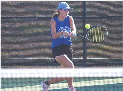 Caroline White hits a backhand during her doubles match with Allison Valdez. HUNTER KING | DISPATCH RECORD