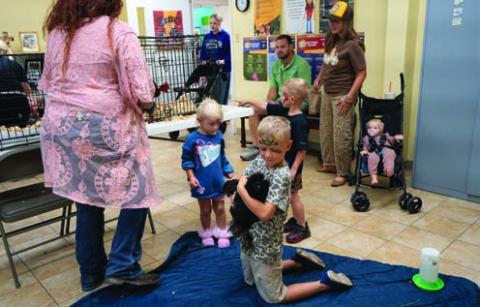 Children play with animals indoors during the Lampasas Methodist Church’s fall festival on Oct. 3. Despite the stormy weather, the event carried on with plenty of activities for visitors. ADAM BARRIOS | DISPATCH RECORD
