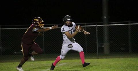 Elijah Golzales chases down the Zephyr quarterback during the Hornets’ dominant win last Friday. MEGAN LUSTY | DISPATCH RECORD