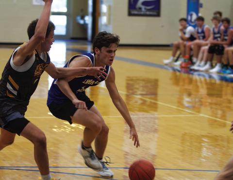 Trent Seneca drives past a Gatesville defender during game on Monday evening. HUNTER KING | DISPATCH RECORD